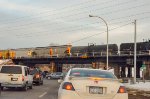 TILX Tank Car and Covered Hoppers over the bridge